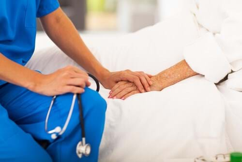 Nurse comforting patient