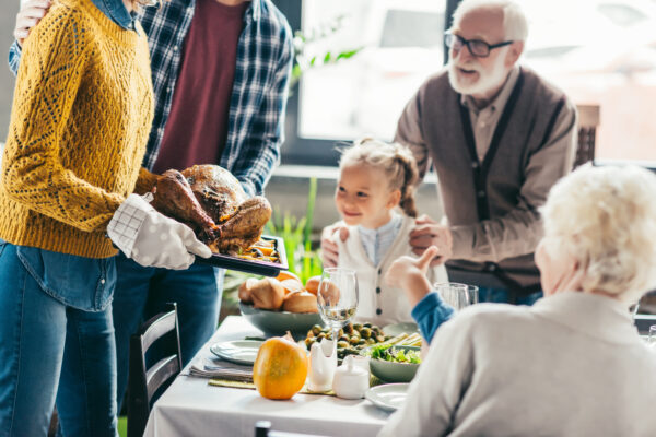 Family looking at thanksgiving turkey